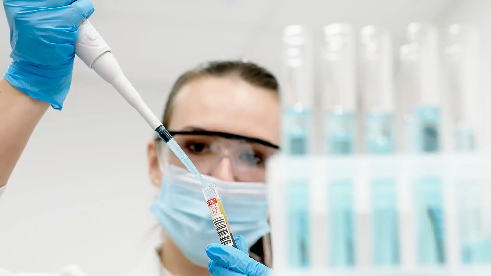 Portrait,Of,A,Beautiful,Female,Scientist,Using,A,Micropipette,For